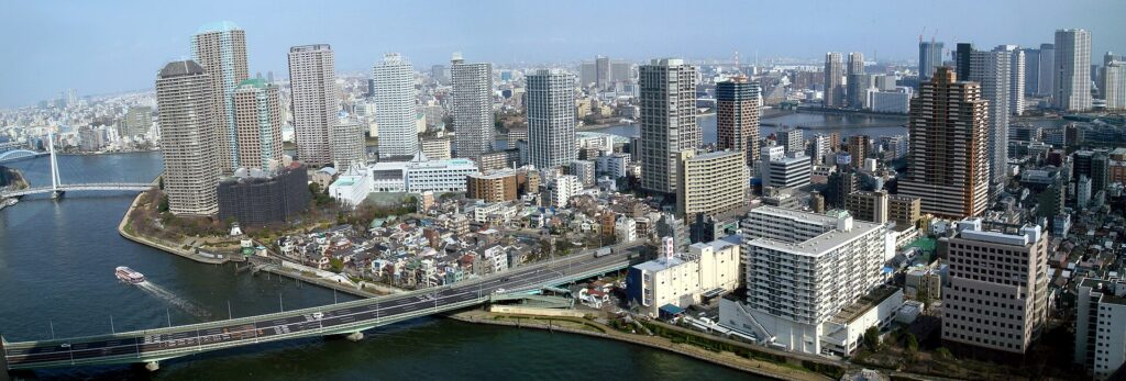 Panoramic view of Tsukishima beside the Sumida River, with bridges and high-rise housing