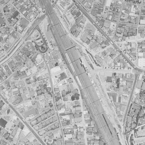Aerial photograph of Ebisu Station, railway tracks and the surrounding brewery district in 1963