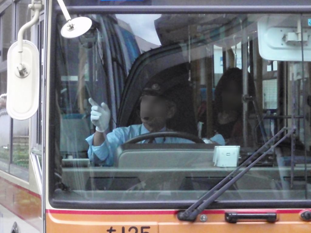A Kanagawa Chuo Kotsu bus driver performing pointing and calling