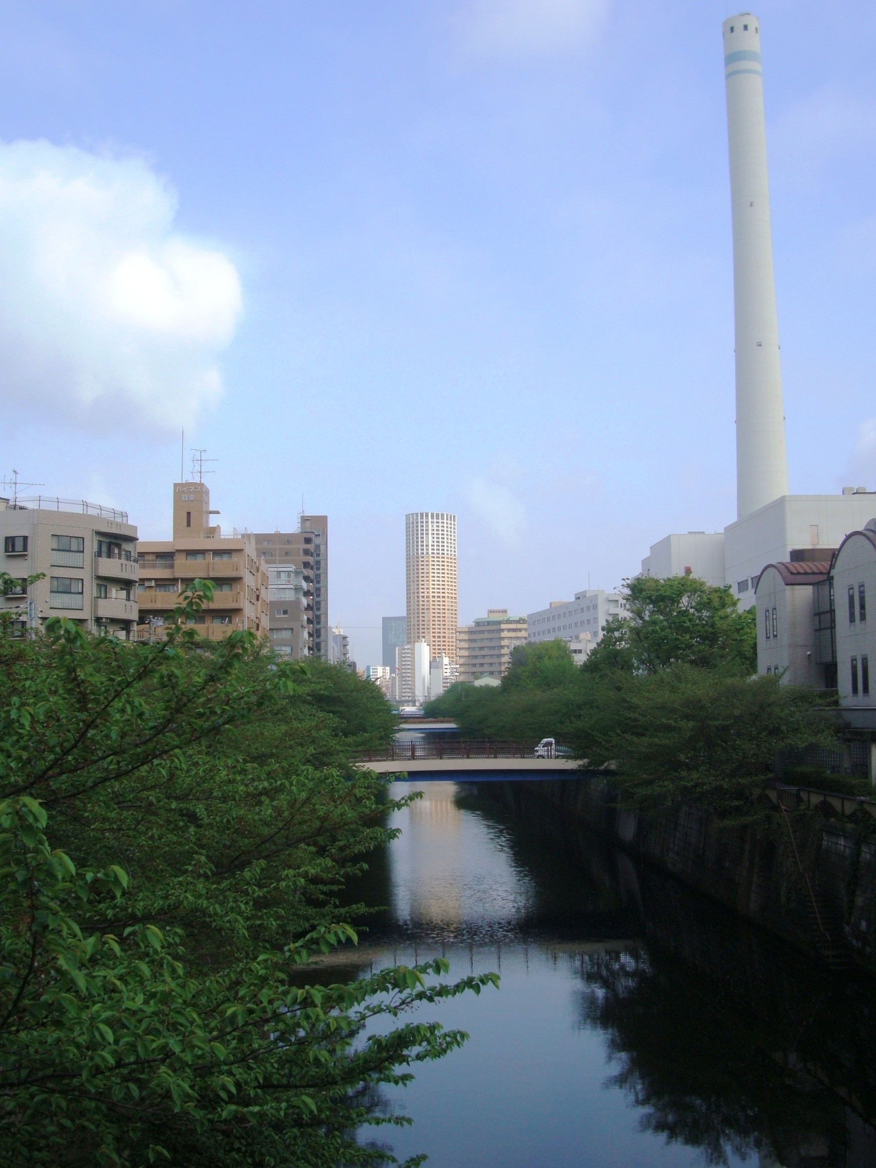 Meguro River in Nakameguro with Atlas Tower and the Meguro Incineration Plant