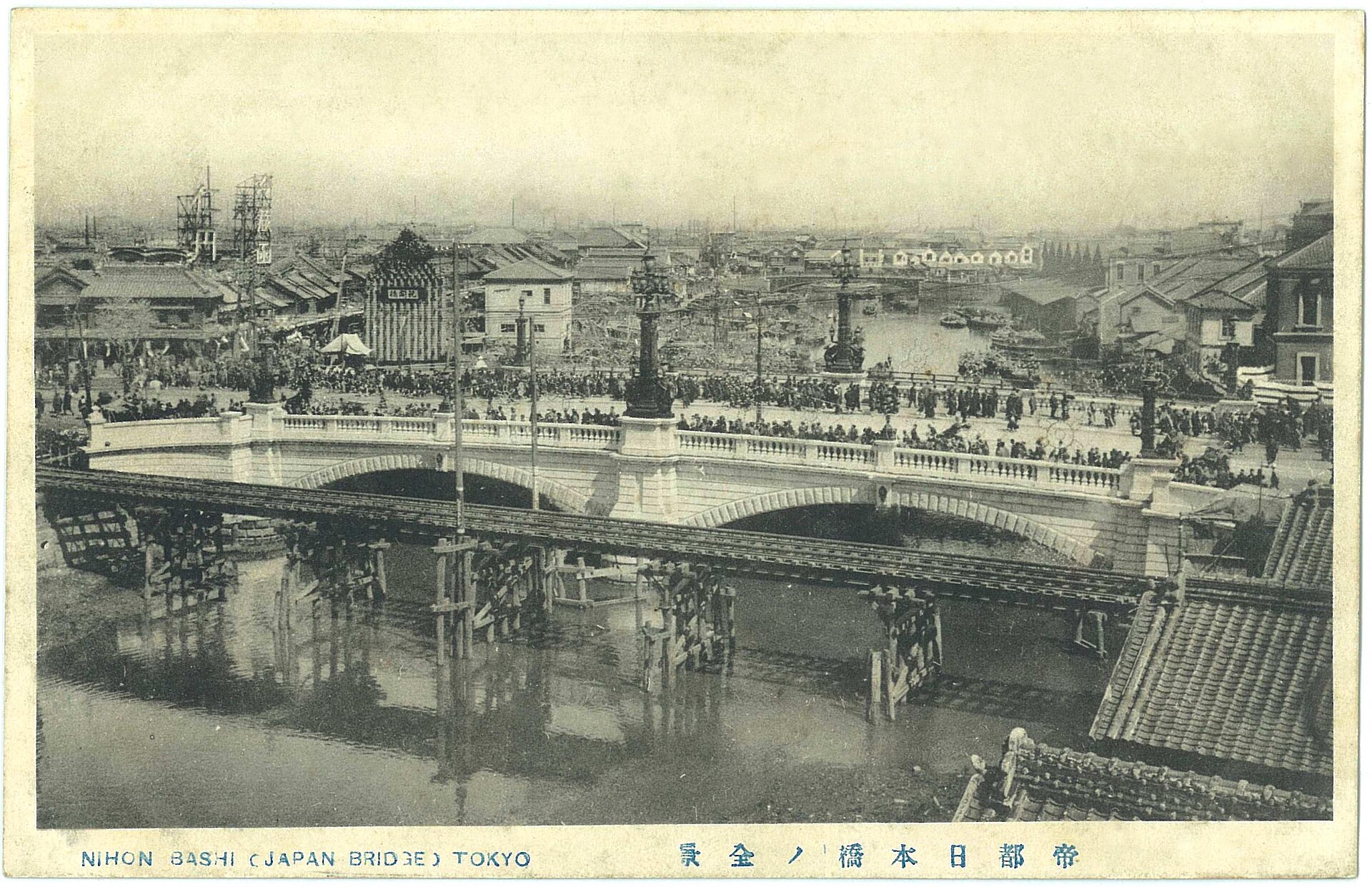 Crowds viewing the newly completed stone Nihonbashi Bridge in April 1911