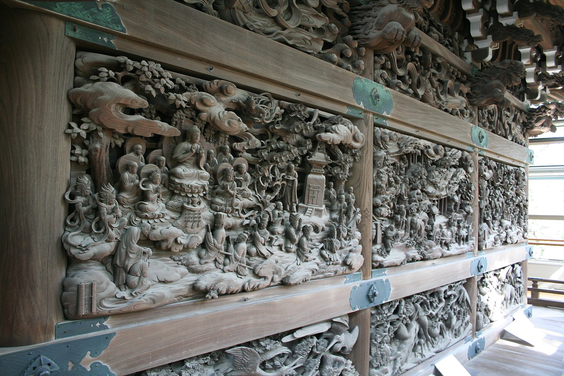 Carved Lotus Sutra panels at Shibamata Taishakuten's sculpture gallery