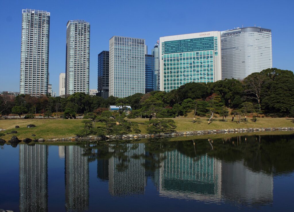 Shiodome skyscrapers reflected in the water beside Hama-rikyu Gardens