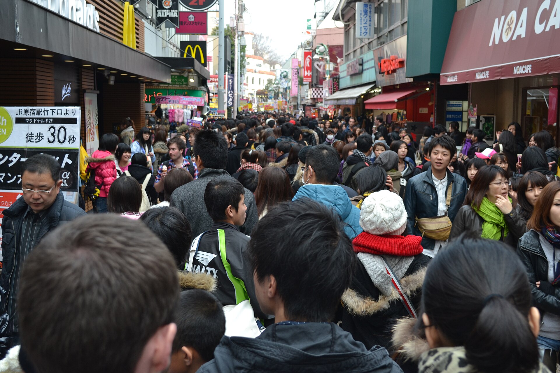 Crowds walking along Takeshita Street in Harajuku, lined with fashion shops