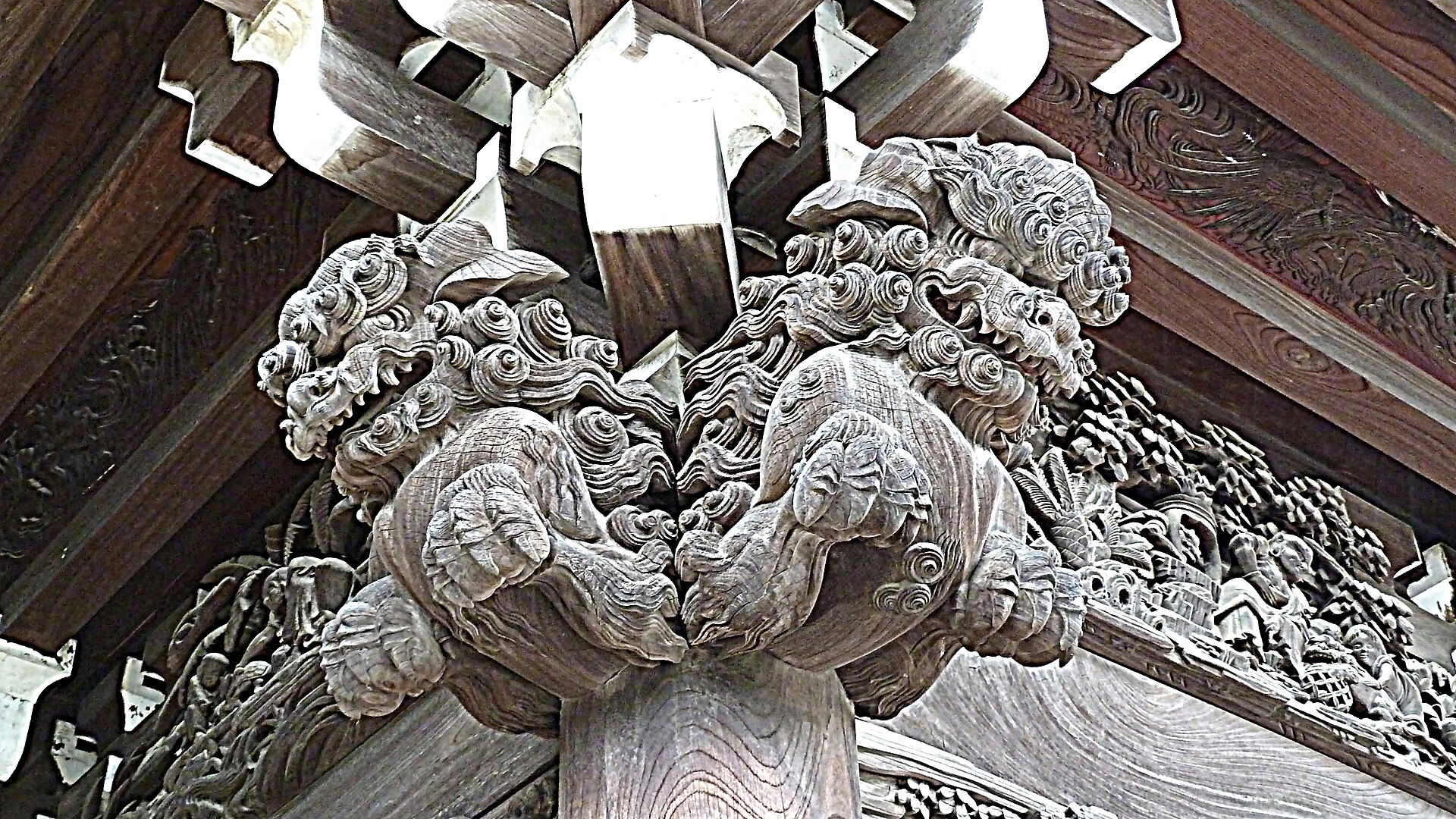 Intricate wooden carvings on a gate at Shibamata Taishakuten