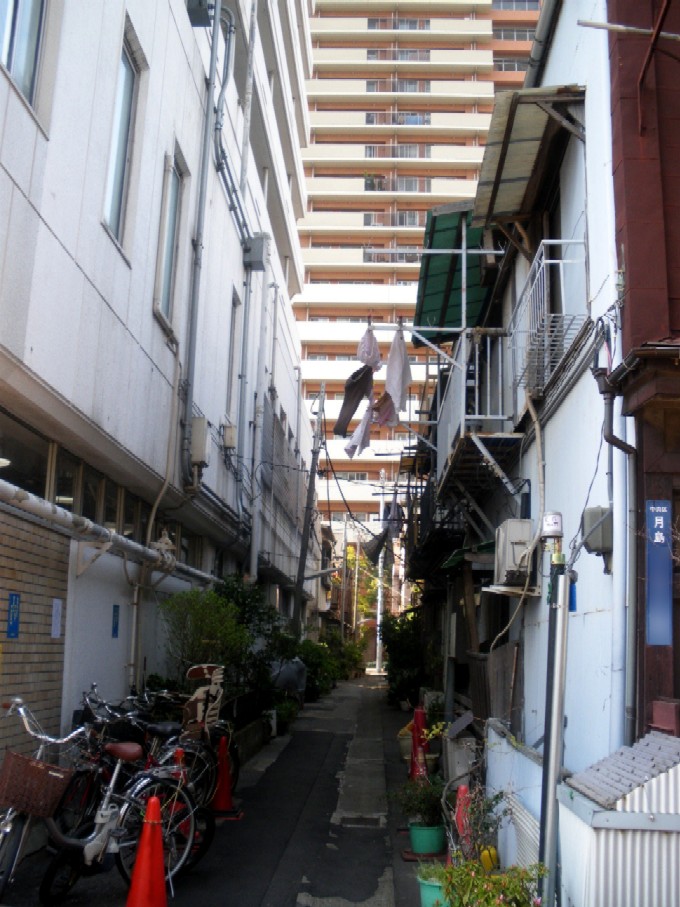 Nagaya row houses along a narrow alley in Tsukishima