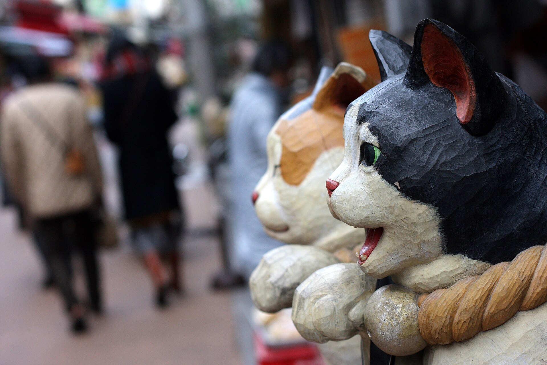 Yanaka Ginza shopping street with storefronts and pedestrians in 2012